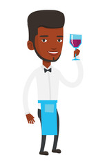 Bartender holding a glass of wine in hand.