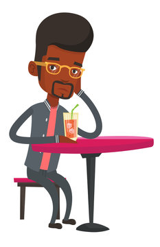 Man drinking cocktail at the bar.