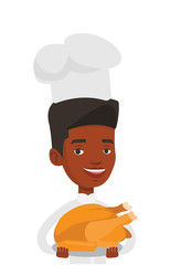 Chief cooker holding roasted chicken.