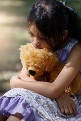 Asia Lovely girl sad mood Hug teddy bear