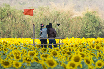 family selfie at sunflower field
