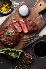 Grilled ribeye beef steak with red wine