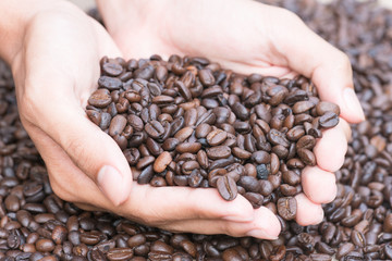 Coffee beans in hands