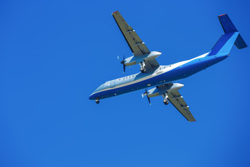 wide-body plane is flying in blue sky