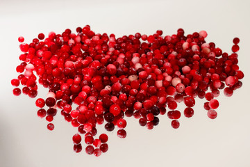 Superfood berries fool of antioxidants - organic cranberries arranged in pile on white background.