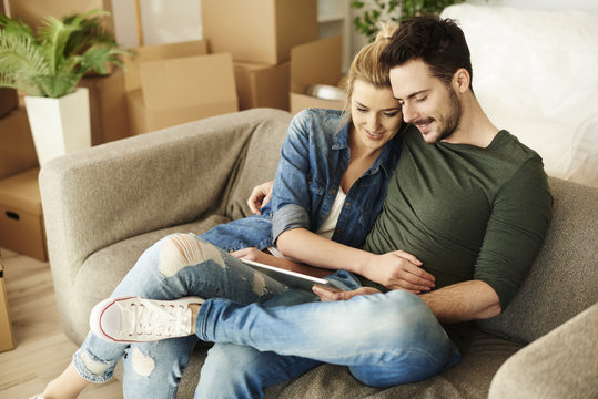 Couple sitting on the sofa in their new place