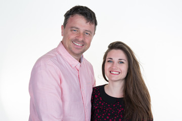 A father in pink shirt with her pretty teenage girl, happy both