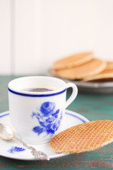 Cup of coffee with a Dutch stroopwafel cookie