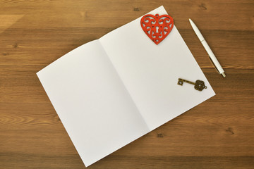 Naklejka na ściany i meble Wooden Heart, paper and keys on a wooden background