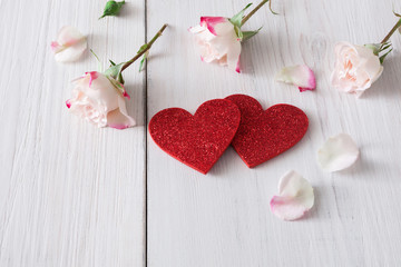 Valentine day background, hearts and flowers on white wood