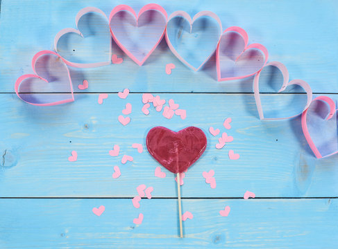 Red lillipop and paper hearts