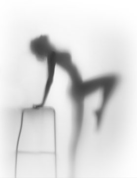 Beautiful and sexy slim woman body silhouette with chair
