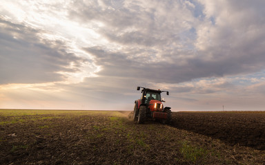 tractor plowing a field