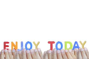 Man fingers showing "ENJOY TODAY" text on white background