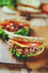 grilled bacon sandwich  on wooden board