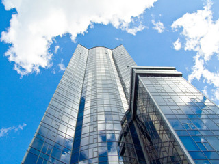 Fototapeta na wymiar Skyscraper with blue sky and clouds