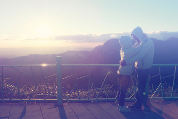 Fototapeta premium Silhouette of couples happy at scenic mountain fog and sun.