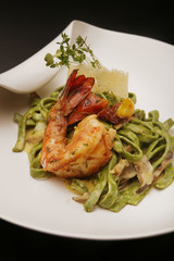 Organic spinach fettuccine pasta with parmesan cheese