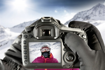 camera and skier in alps 