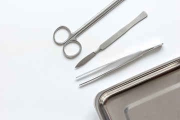 instruments for plastic surgery on white background