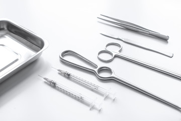 instruments for plastic surgery on white background