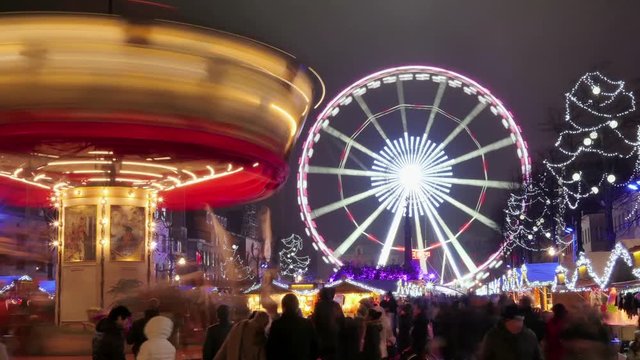 Traditional Christmas Fair Crowded in Brussels. Carousel and fair ferris wheel time lapse.
Christmas atmosphere in the city center of Brussels.
Great illuminated Christmas fair crowded.
