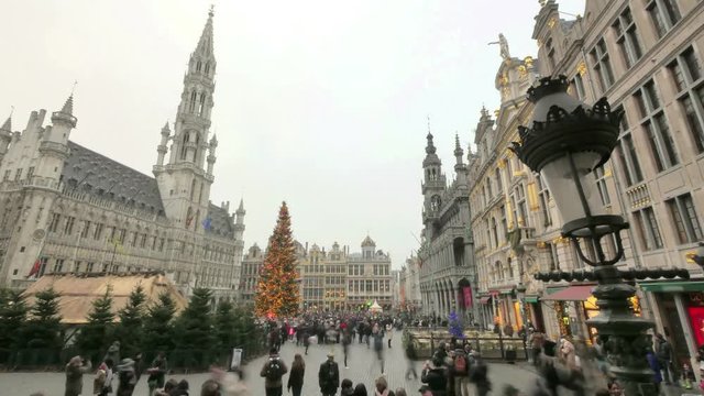 Crowded Brussels Grand Place in Christmas Time Lapse.

Christmas atmosphere in the city center of Brussels. Great illuminated Christmas tree with crowds of tourists.