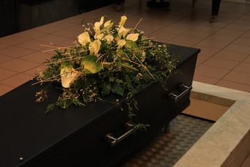 Coffin with funeral flowers