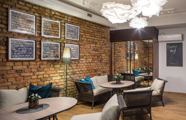 Interior of restaurant.  Brick wall. Modern design.