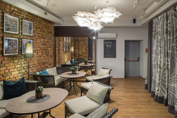 Interior of restaurant.  Brick wall. Modern design.