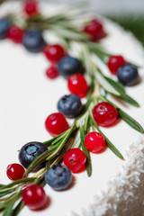 Naklejka na ściany i meble cranberry and blueberry on Christmas cake 