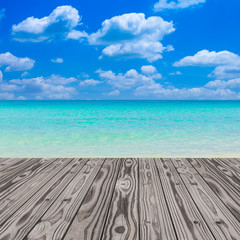 Fototapeta premium Wood grain deck floor over beautiful sea and sky background