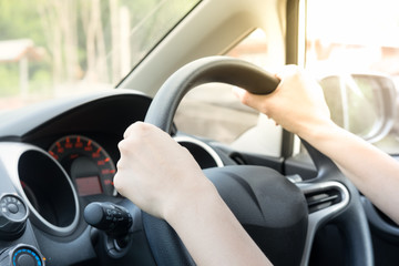 Female driving car.
