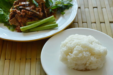 sticky rice eat couple with spicy minced pork and liver salad 