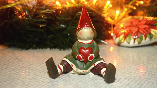 close up of decorative Christmas ornaments with blinking lights background