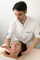 Fototapeta na wymiar Master does massage to client on white background
