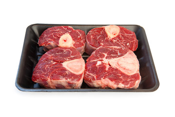 A piece of raw meat on the bones of the calf