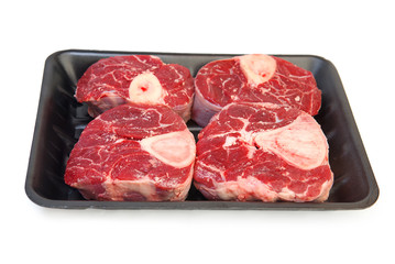 A piece of raw meat on the bones of the calf