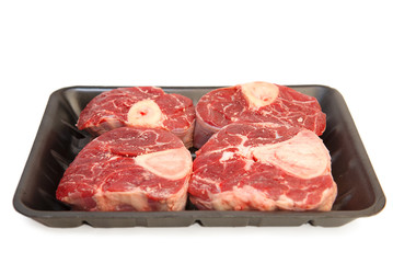 A piece of raw meat on the bones of the calf