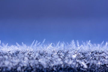 winter background with glittering ice crystals with copy space,  macro photos. shallow depth of field