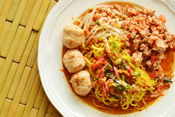Chinese yellow noodle dressing spicy pork ball with dried shrimp soup