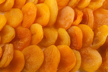 Dried apricots at white plate close-up