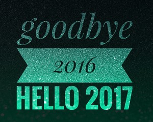 Welcome 2017, Happy New Year and good bye 2016 words on shiny green and black glitter background.
