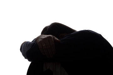 A young man with grief tearing at her hair
