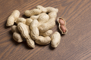 Peanuts on wooden background