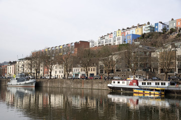Colourful homes line the waterfront of the floating harbour in Bristol England UK