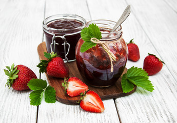 Strawberry jam and fresh strawberries