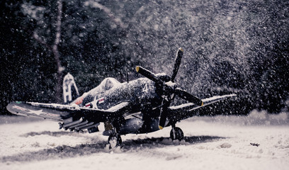 World war II military aircraft with heavy snowfall
