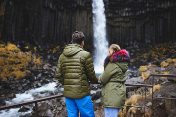 Couple Enjoying Waterfall
