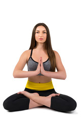 Fototapeta premium Yoga. Portrait of a beautiful sports girl on a white background